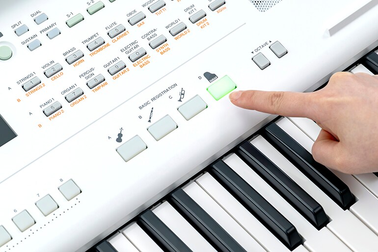 A player operating the Basic Registration buttons to recall their favorite sound settings with a single touch 
