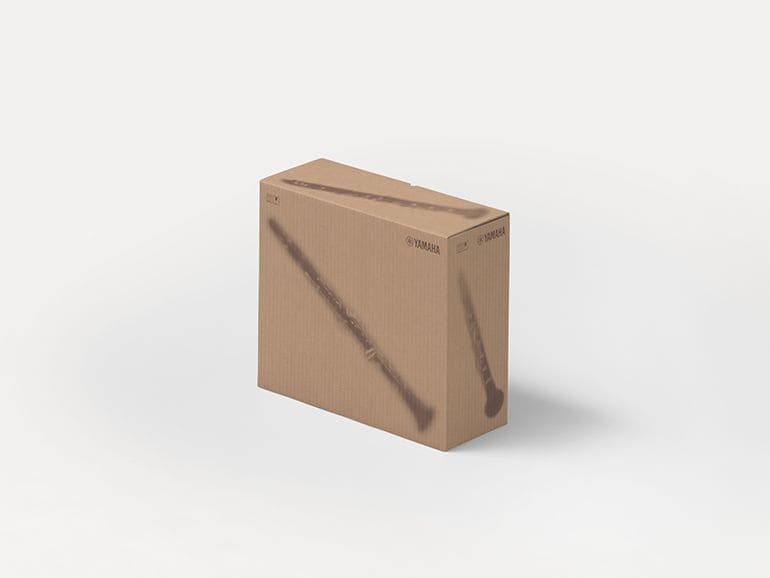 Yamaha cardboard shipping boxes with printed silhouettes of musical instruments.