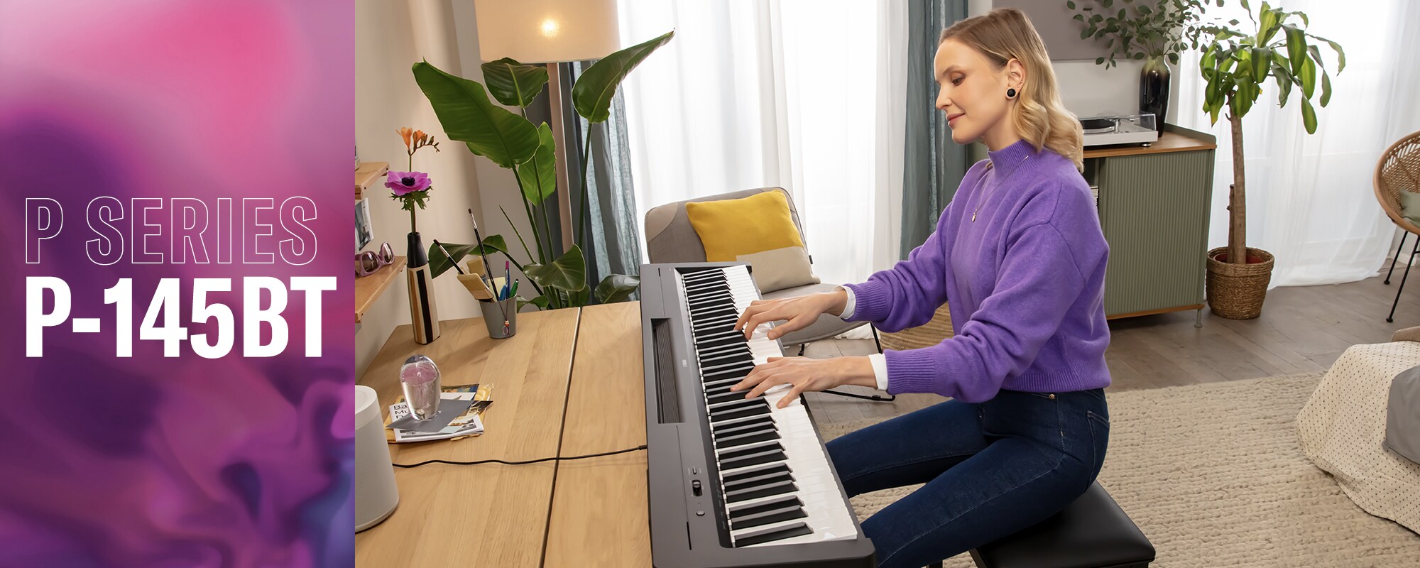 A person playing the P-145BTB on a desk