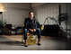 Chris Buck sitting and holding his Signature Revstar RS02CB guitar
